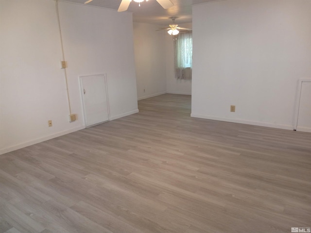 spare room featuring ceiling fan and light hardwood / wood-style flooring