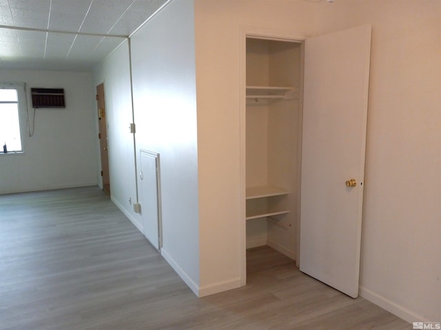 closet with a wall mounted air conditioner