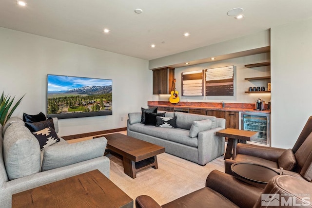 living room with light colored carpet, bar, and wine cooler