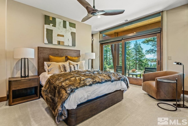 carpeted bedroom featuring ceiling fan and access to exterior