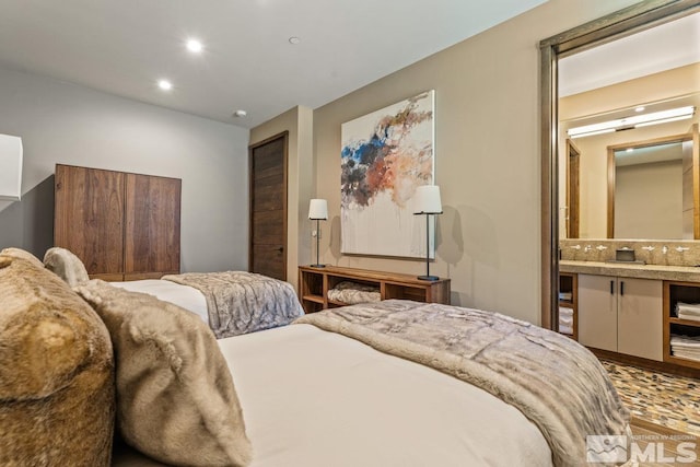 bedroom featuring ensuite bathroom