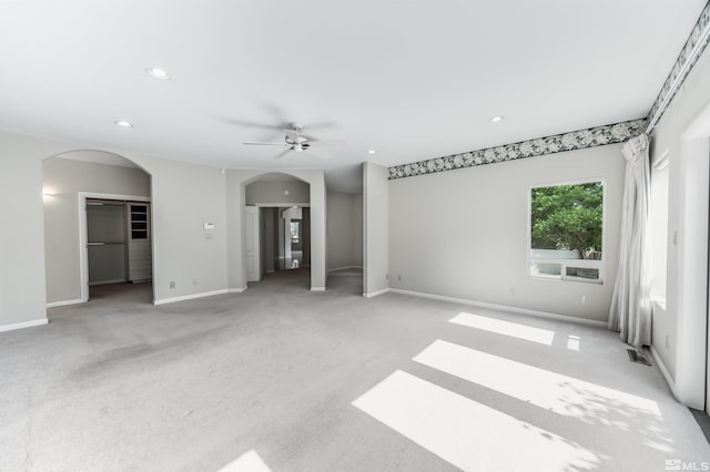 carpeted empty room with ceiling fan