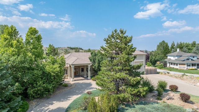 view of property hidden behind natural elements