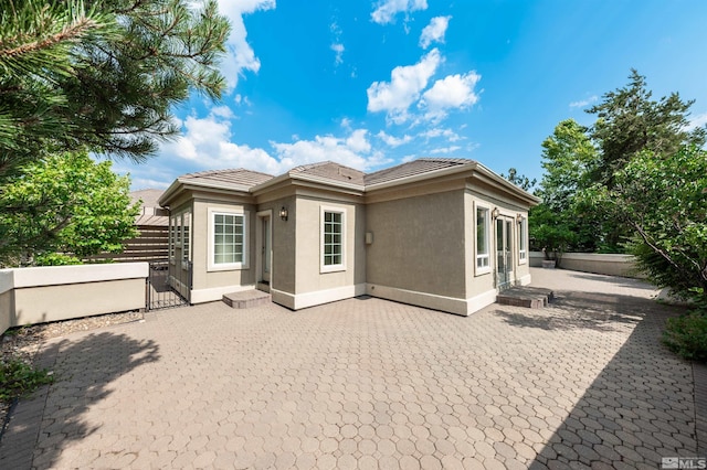 back of house featuring a patio