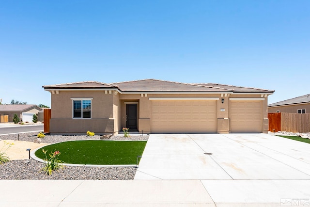 prairie-style home featuring a garage