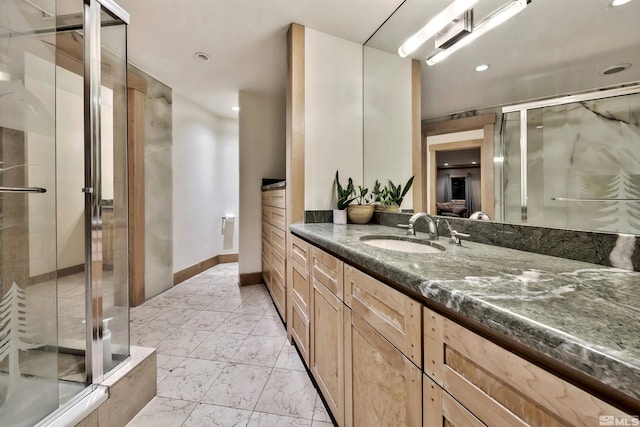 bathroom with vanity, tile patterned floors, and walk in shower