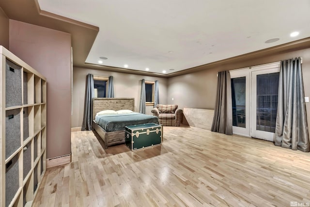 bedroom featuring light hardwood / wood-style floors and access to exterior