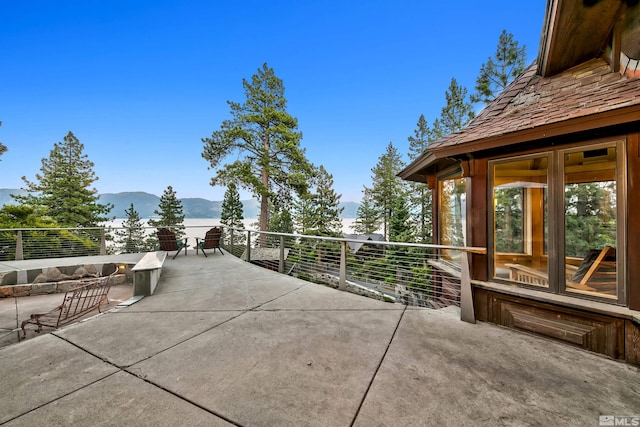 view of patio / terrace featuring a mountain view and a balcony