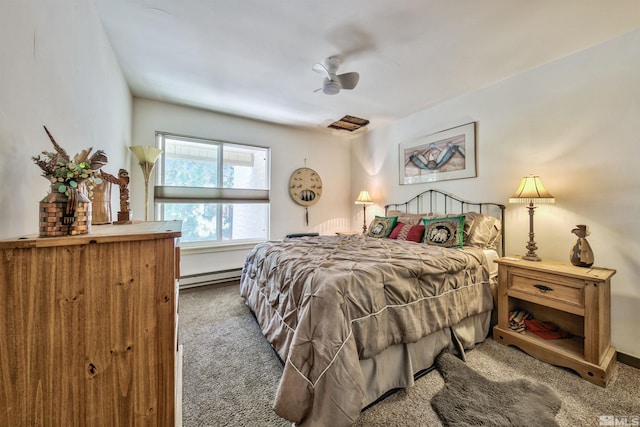 carpeted bedroom with baseboard heating