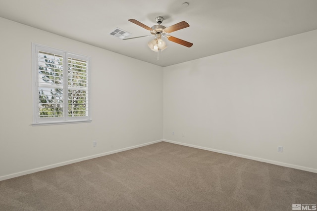 unfurnished room with ceiling fan and carpet floors