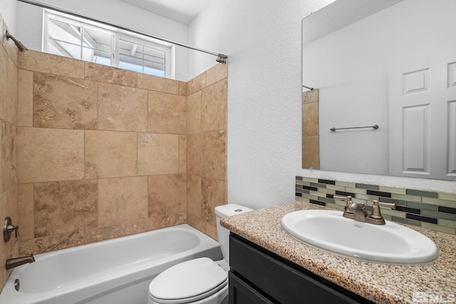 full bathroom featuring vanity, decorative backsplash, toilet, and tiled shower / bath