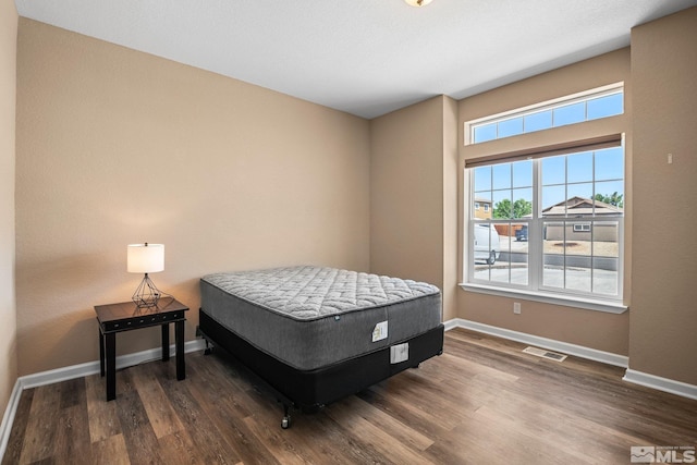 bedroom featuring dark wood-type flooring