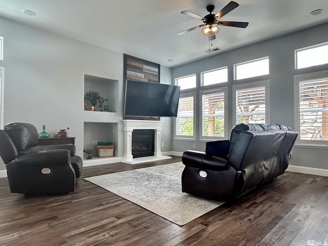 living room with hardwood / wood-style flooring and ceiling fan