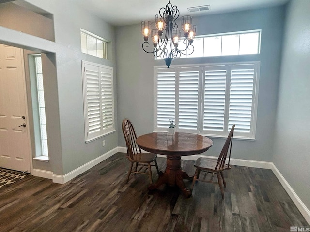 dining room featuring wood-type flooring and a chandelier