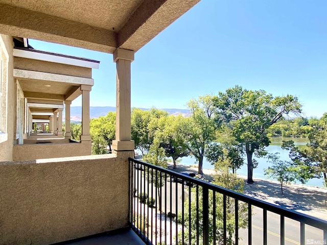 balcony featuring a water view