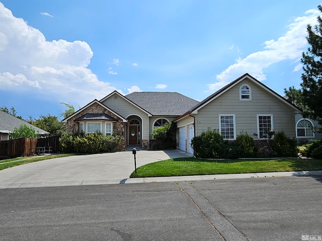 ranch-style house with a garage and a front yard