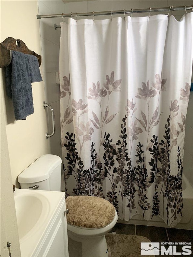 bathroom featuring vanity and toilet