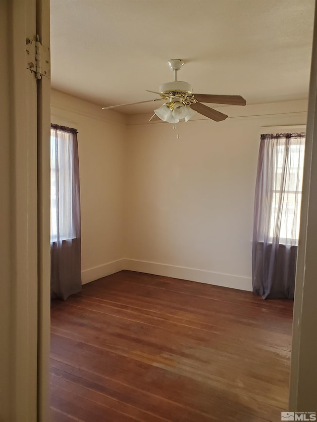 unfurnished room with hardwood / wood-style flooring and ceiling fan