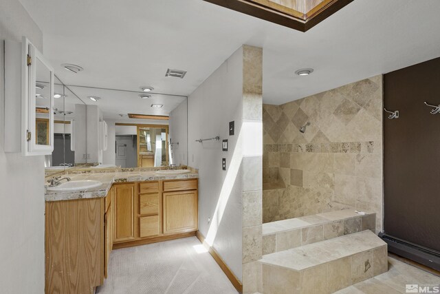 bathroom with plus walk in shower, tile patterned floors, and dual bowl vanity