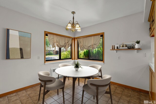 tiled dining space with a notable chandelier and a wealth of natural light