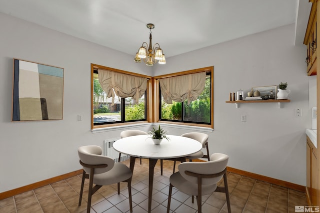 dining room featuring an inviting chandelier and tile patterned floors