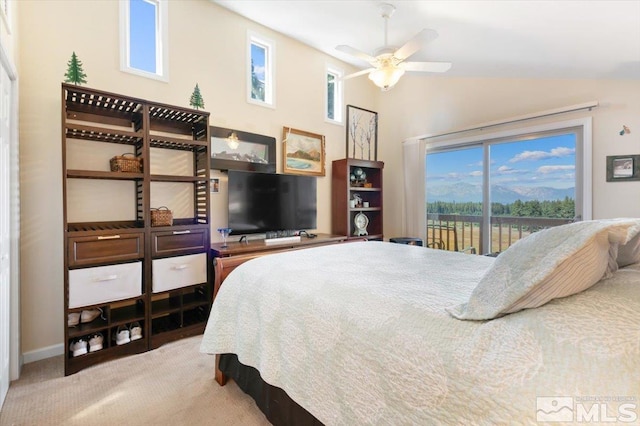 bedroom featuring multiple windows, carpet floors, access to outside, and ceiling fan