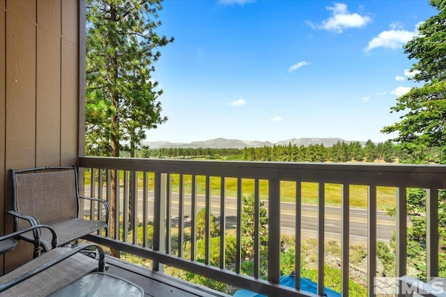 balcony featuring a mountain view