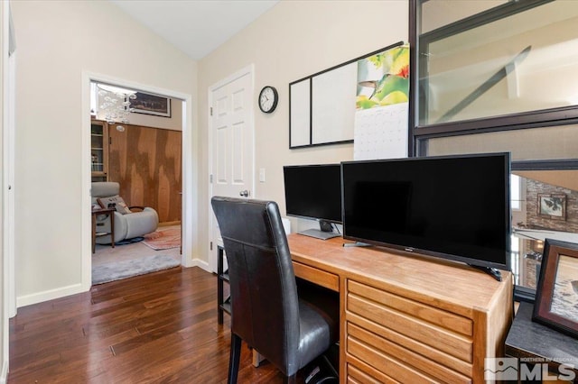 office space featuring vaulted ceiling and dark hardwood / wood-style floors