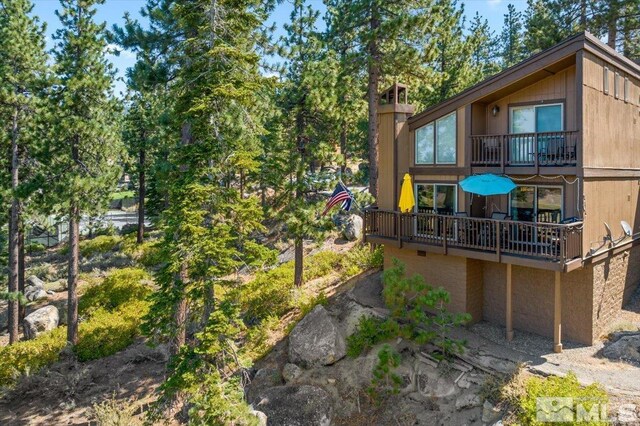 rear view of property with a balcony