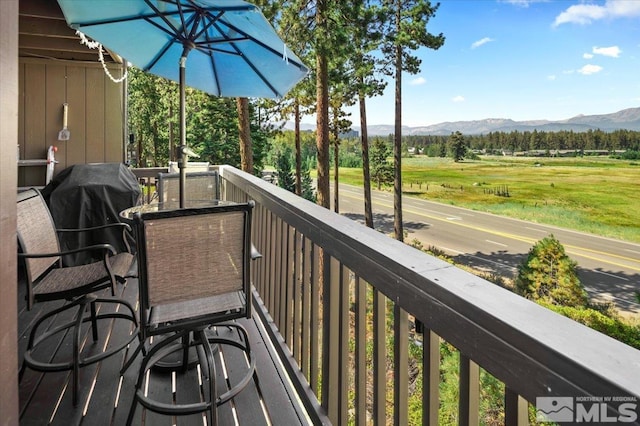 balcony with area for grilling and a mountain view