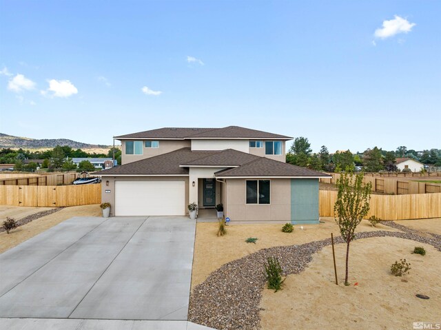 view of front of property featuring a garage