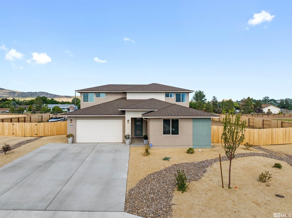 view of front of property featuring a garage