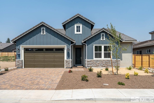 craftsman-style home with a garage