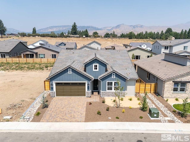 view of front of house featuring a garage and a mountain view