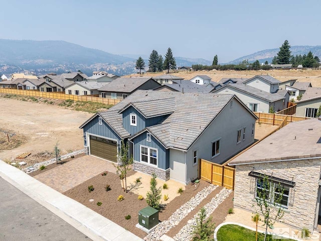 view of front of house with a mountain view and a garage