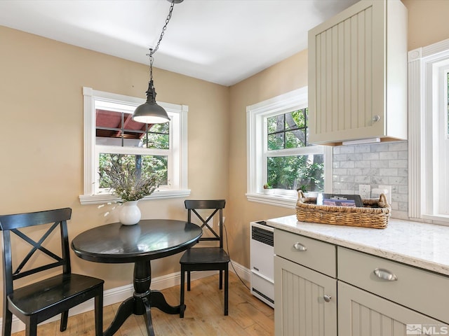 dining space with light wood-type flooring