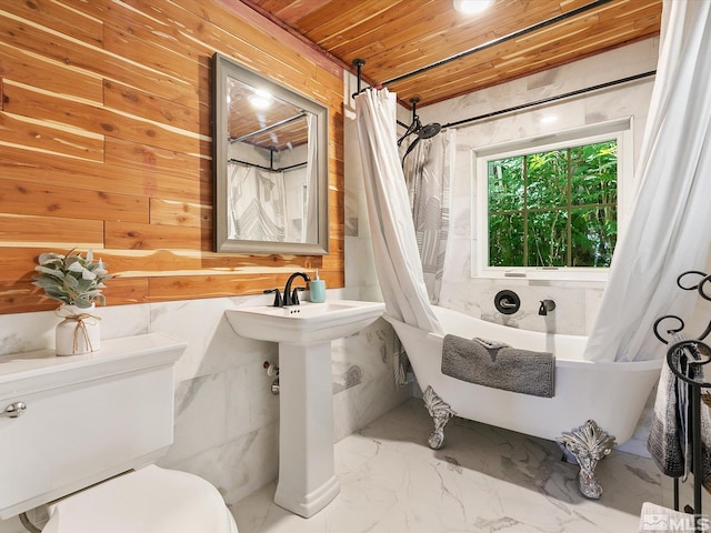 bathroom featuring wooden walls, shower / bathtub combination with curtain, wood ceiling, and toilet