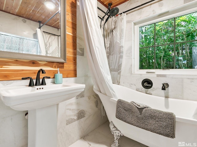 bathroom with shower / bathtub combination with curtain and wood ceiling