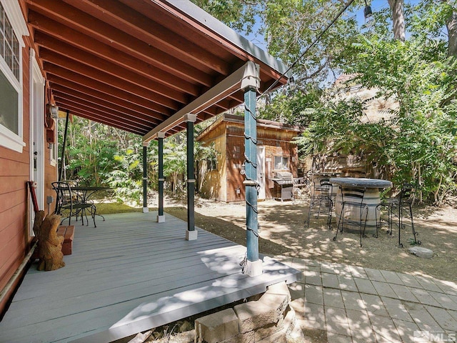 wooden deck featuring area for grilling