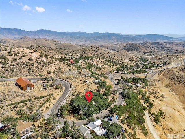 birds eye view of property featuring a mountain view