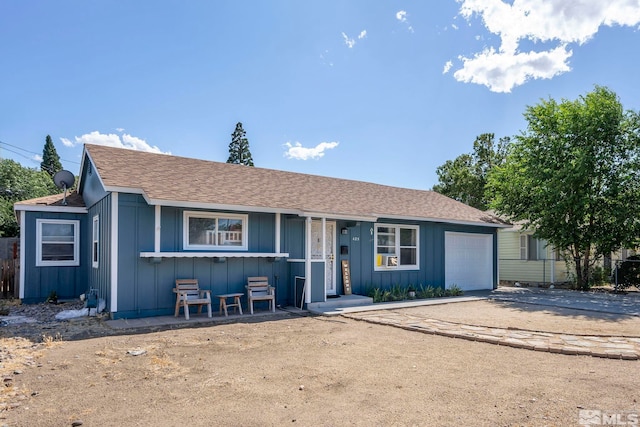 ranch-style home featuring a garage