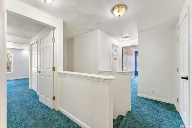 hallway with carpet flooring