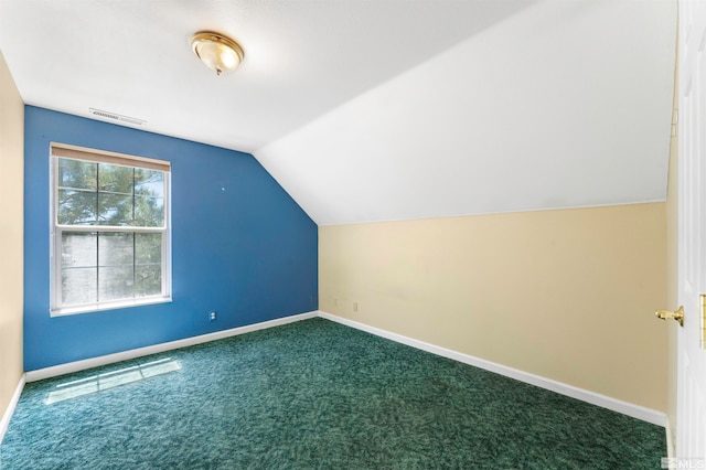 additional living space with lofted ceiling and carpet flooring