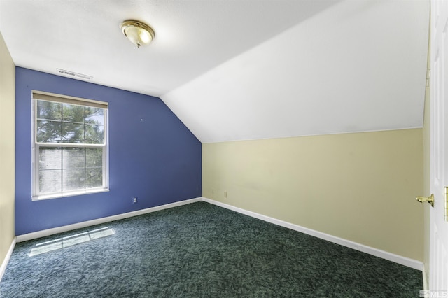 bonus room with visible vents, baseboards, and dark colored carpet