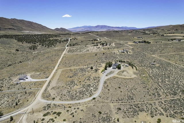 bird's eye view featuring a desert view and a mountain view