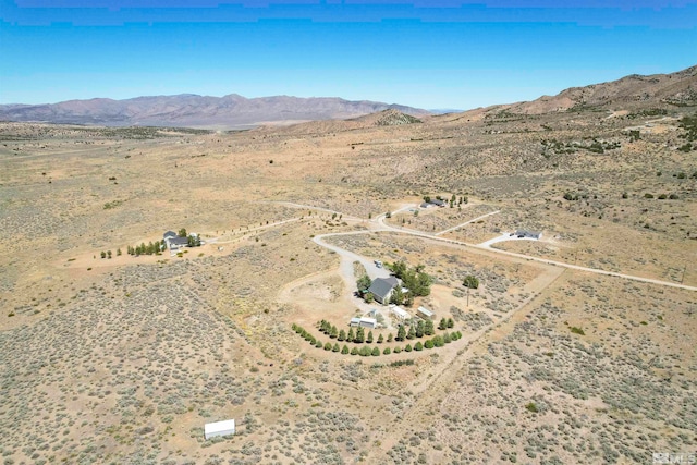 birds eye view of property featuring a mountain view