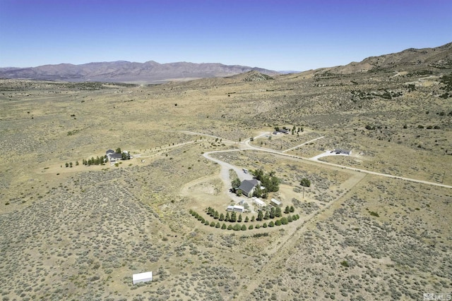 bird's eye view with a mountain view, a desert view, and a rural view