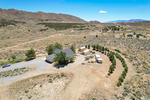 birds eye view of property with a mountain view