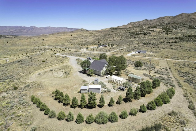 bird's eye view featuring a rural view and a mountain view