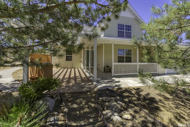 back of house with covered porch